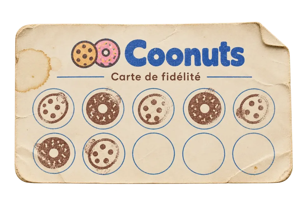 Ancienne carte de fidélité papier Coonuts, usée et tamponnée